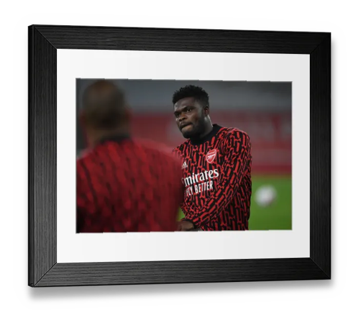 Framed Print : Arsenal's Thomas Partey Prepares for Aston Villa Clash in Empty Emirates Stadium (2020-21) Framed Print : Arsenal's Thomas Partey Prepares for Aston Villa Clash in Empty Emirates Stadium (2020-21)