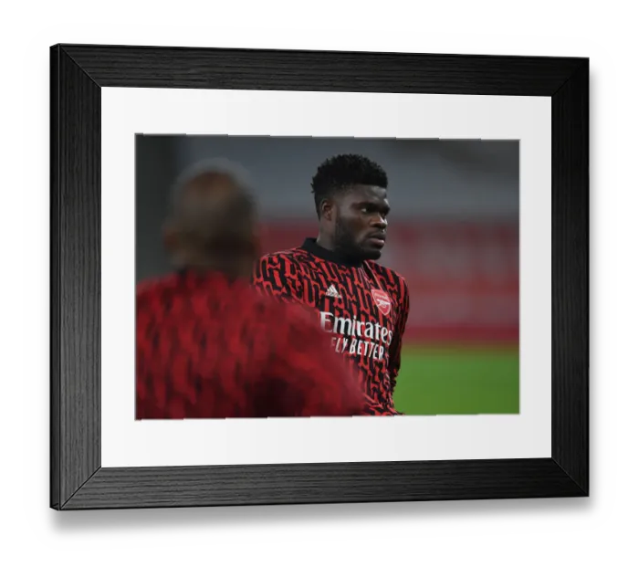 Framed Print : Thomas Partey Prepares for Aston Villa Battle at Empty Emirates Stadium (Arsenal vs. Aston Villa, 2020-21)