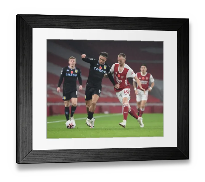 Framed Print : Rob Holding vs Jack Grealish: Premier League Face-Off in Empty Emirates Stadium - Arsenal vs Aston Villa (November 2020) Framed Print : Rob Holding vs Jack Grealish: Premier League Face-Off in Empty Emirates Stadium - Arsenal vs Aston Villa (November 2020)