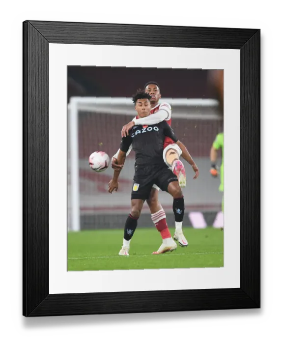 Framed Print : Arsenal vs. Aston Villa: Gabriel vs. Watkins in Empty Emirates Stadium, Premier League 2020-21 Framed Print : Arsenal vs. Aston Villa: Gabriel vs. Watkins in Empty Emirates Stadium, Premier League 2020-21