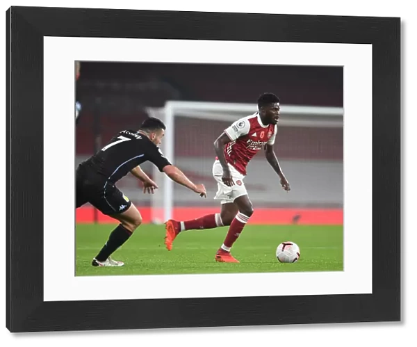 Arsenal's Thomas Partey in Action against Aston Villa in Empty Emirates Stadium - Premier League 2020-21