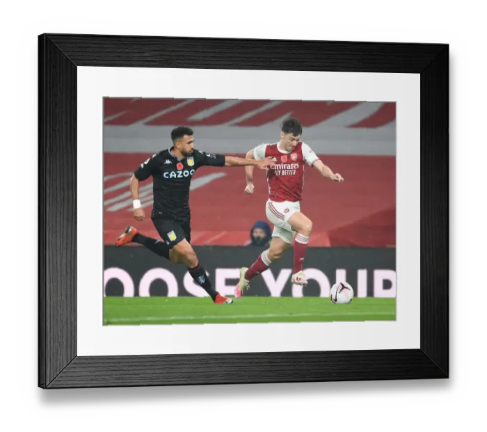 Framed Print : Arsenal's Kieran Tierney Outmaneuvers Aston Villa's Trezeguet in Empty Emirates Stadium Framed Print : Arsenal's Kieran Tierney Outmaneuvers Aston Villa's Trezeguet in Empty Emirates Stadium