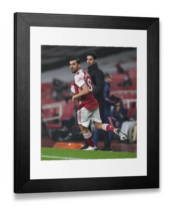 Framed Print : Arsenal's Mikel Arteta and Dani Ceballos: A Behind-Closed-Doors Battle Against Aston Villa in the Premier League