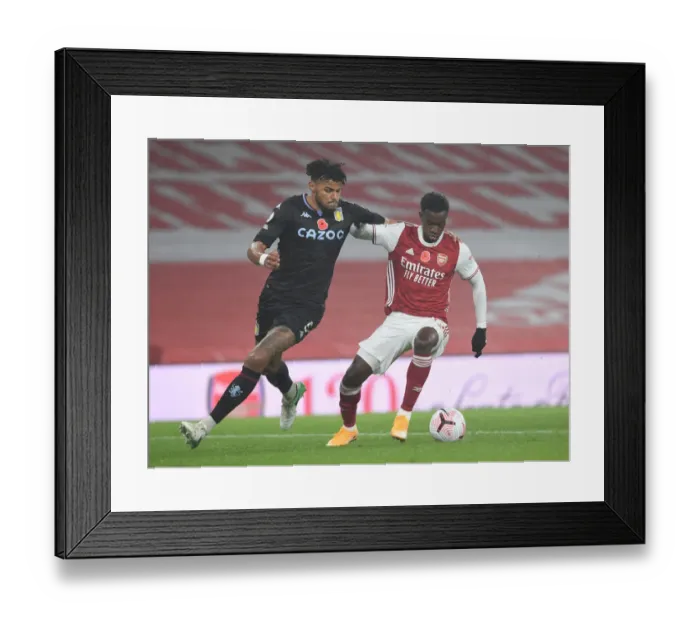 Framed Print : Arsenal vs Aston Villa: Eddie Nketiah vs Tyrone Mings - Premier League Clash Amidst Empty Emirates Stadium (November 2020) Framed Print : Arsenal vs Aston Villa: Eddie Nketiah vs Tyrone Mings - Premier League Clash Amidst Empty Emirates Stadium (November 2020)