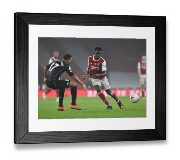 Framed Print : Arsenal's Bukayo Saka in Action: Premier League Showdown at Empty Emirates Stadium (Arsenal vs Aston Villa, 2020-21)