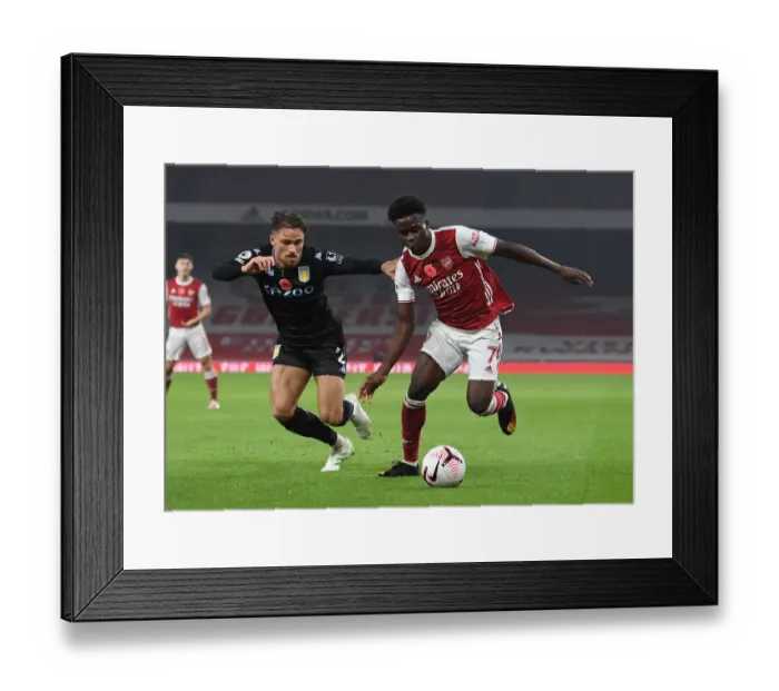 Framed Print : Saka vs. Cash: A Footballing Battle in Arsenal vs. Aston Villa Framed Print : Saka vs. Cash: A Footballing Battle in Arsenal vs. Aston Villa