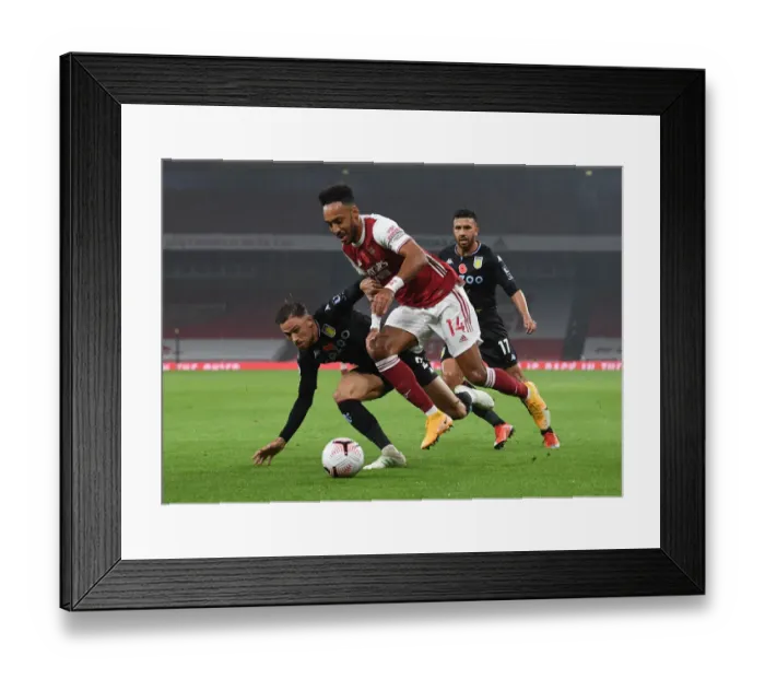 Framed Print : Aubameyang vs. Cash: Intense Battle in Arsenal vs. Aston Villa Premier League Clash