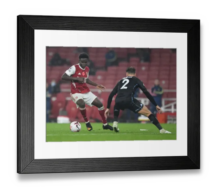 Framed Print : Saka vs. Cash: A Premier League Face-Off at Emirates Stadium Framed Print : Saka vs. Cash: A Premier League Face-Off at Emirates Stadium