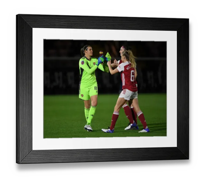 Framed Print : Fist Bumps in Empty Stands: Arsenal Women vs. Tottenham Hotspur Women in the FA Womens Continental League Cup