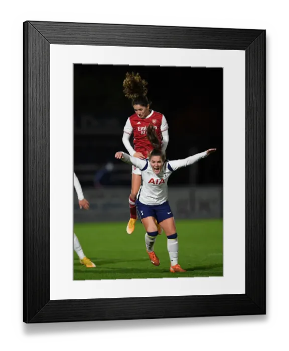 Framed Print : Arsenal's Van de Donk Soars Above Tottenham in Empty FA WSL Cup Match Framed Print : Arsenal's Van de Donk Soars Above Tottenham in Empty FA WSL Cup Match