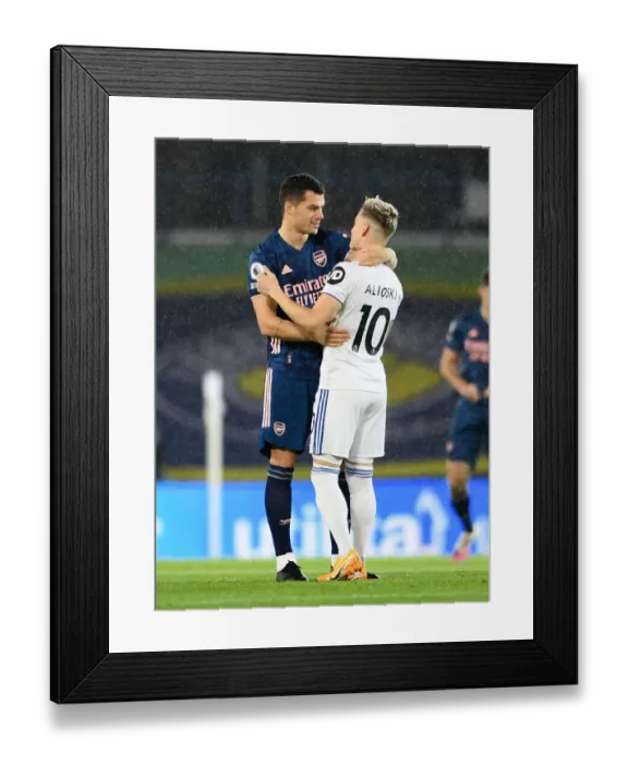 Framed Print : Arsenal's Granit Xhaka Embraces Ezgjan Alioski of Leeds United - Premier League Clash, November 2020