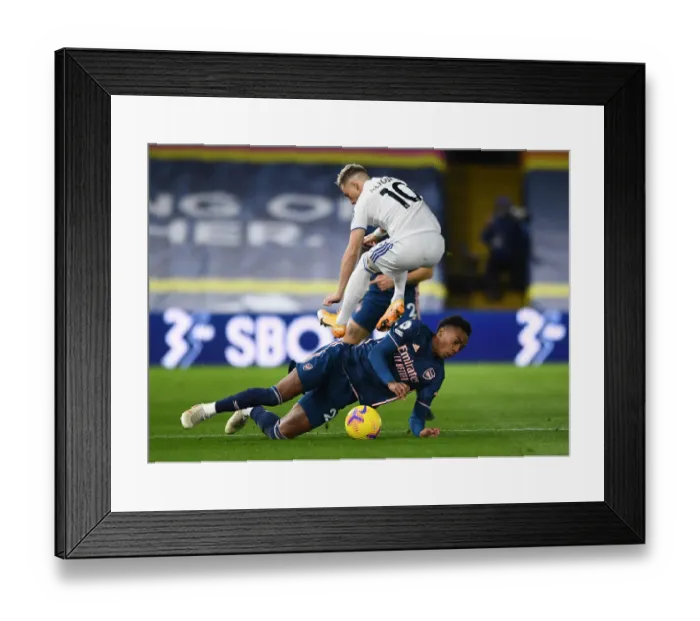 Framed Print : Battle at Elland Road: Willock vs. Alioski - A Premier League Clash of Supremacy