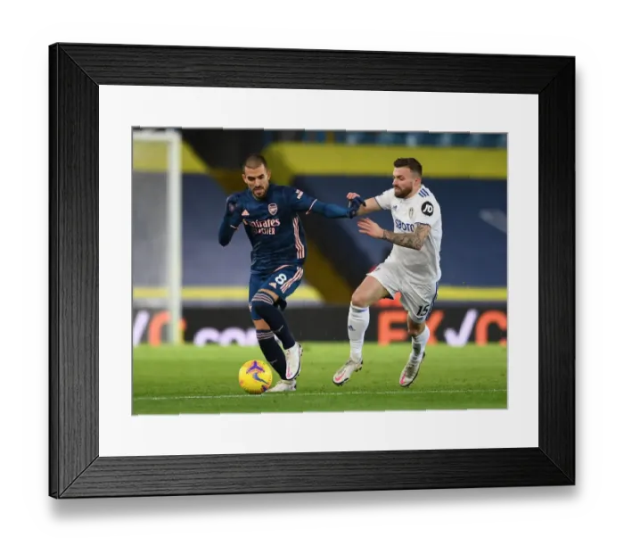 Framed Print : Dani Ceballos vs Stuart Dallas: Battle at Elland Road - Leeds United vs Arsenal, Premier League 2020-21