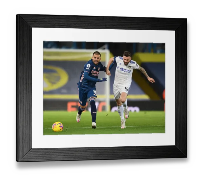 Framed Print : Dani Ceballos vs. Stuart Dallas: Clash of the Midfielders - Leeds United vs. Arsenal, Premier League 2020-21