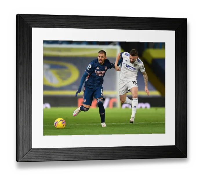 Framed Print : Dani Ceballos vs Stuart Dallas: Clash of the Midfielders - Leeds United vs Arsenal, Premier League 2020-21