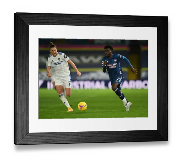 Framed Print : Bukayo Saka vs Luke Ayling: Clash at Elland Road - Leeds United vs Arsenal, Premier League 2020-21