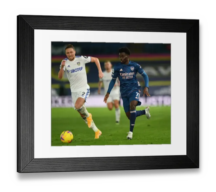 Framed Print : Bukayo Saka vs Luke Ayling: Battle at Elland Road - Leeds United vs Arsenal, Premier League 2020-21