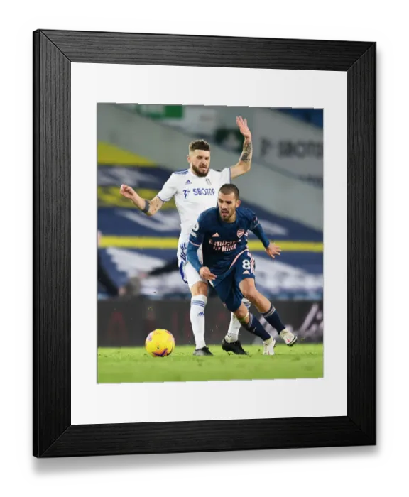Framed Print : Dani Ceballos vs Mateusz Klich: Intense Battle in Leeds United vs Arsenal Premier League Clash