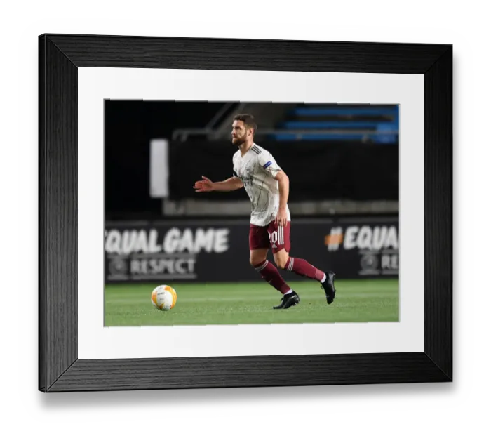 Framed Print : Arsenal's Mustafi in Action against Molde FK in Europa League Group Stage