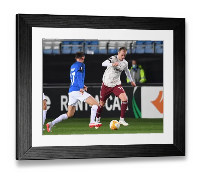 Framed Print : Rob Holding in Action: Arsenal's Europa League Battle against Molde FK