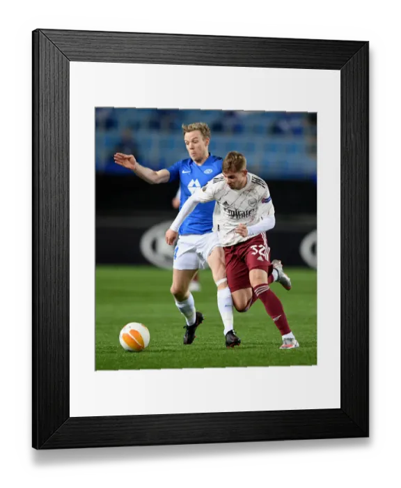 Framed Print : Emile Smith Rowe vs Erling Knudtzon: A Star-Studded Clash in Molde FK vs Arsenal FC UEFA Europa League Match Framed Print : Emile Smith Rowe vs Erling Knudtzon: A Star-Studded Clash in Molde FK vs Arsenal FC UEFA Europa League Match