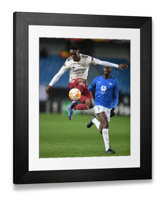 Framed Print : Arsenal's Flo Balogun in Action against Molde FK in Europa League Group Stage