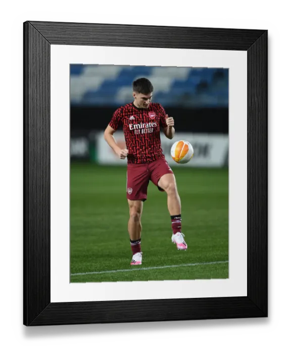 Framed Print : Arsenal's Kieran Tierney Warms Up Ahead of Molde Clash in Europa League
