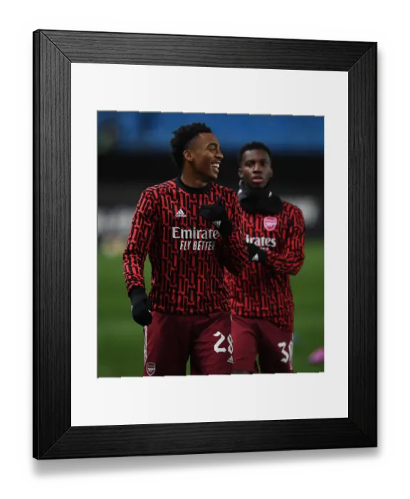 Framed Print : Arsenal's Joe Willock Warming Up Ahead of Molde FK Clash in Europa League