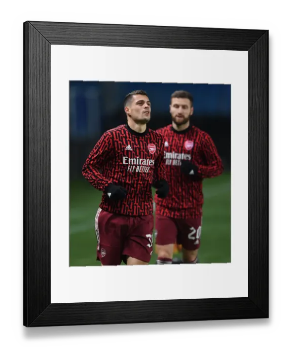 Framed Print : Arsenal's Granit Xhaka Warms Up Ahead of Molde FK Clash in Europa League