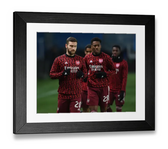 Framed Print : Arsenal's Mustafi Warming Up Ahead of Molde Clash in Europa League