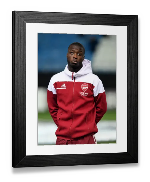 Framed Print : Arsenal's Nicolas Pepe Prepares for Molde FK Clash in Europa League Group Stage Framed Print : Arsenal's Nicolas Pepe Prepares for Molde FK Clash in Europa League Group Stage