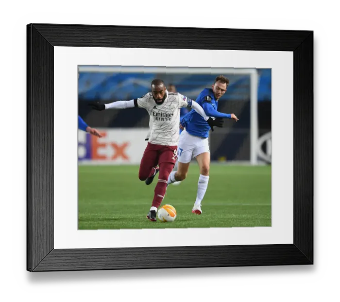 Framed Print : Alexandre Lacazette Faces Off Against Molde: Arsenal's Europa League Battle