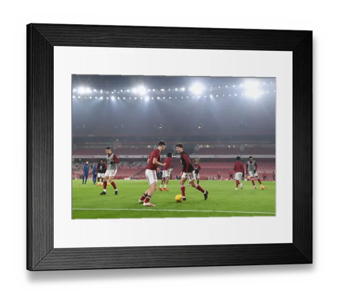 Framed Print : Arsenal Players Kieran Tierney and Hector Bellerin Warm Up Ahead of Emirates Stadium Showdown: Arsenal vs. Wolverhampton Wanderers (2020-21)