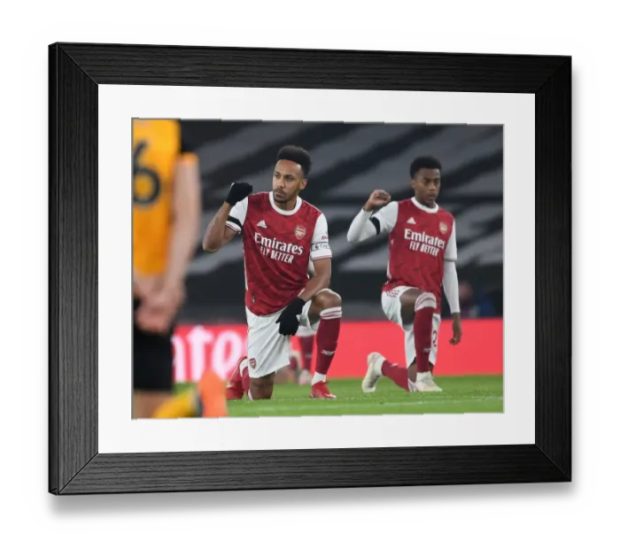 Framed Print : Arsenal's Aubameyang Takes a Knee in Empty Emirates Stadium vs. Wolverhampton Wanderers (2020-21) Framed Print : Arsenal's Aubameyang Takes a Knee in Empty Emirates Stadium vs. Wolverhampton Wanderers (2020-21)