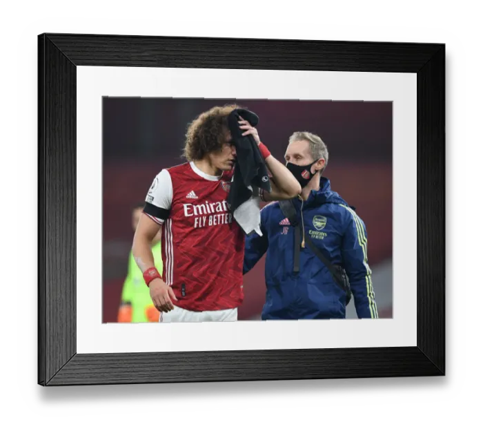Framed Print : Arsenal's David Luiz Treatment for Head Injury in Empty Emirates Stadium (Premier League 2020-21)