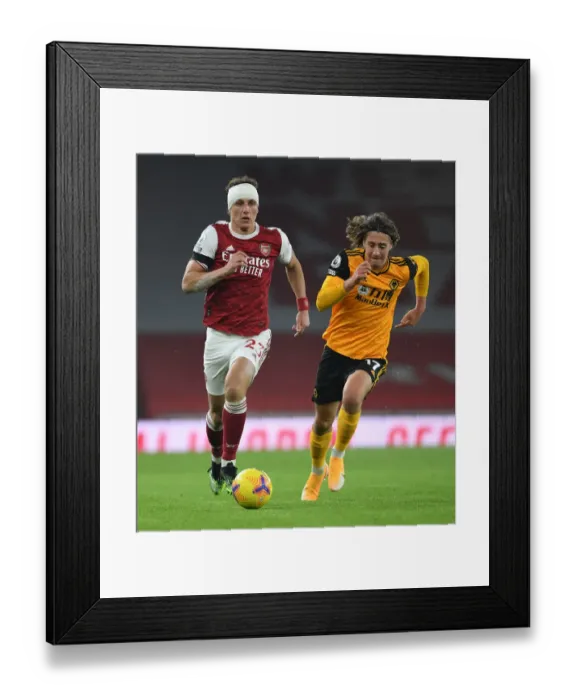 Framed Print : David Luiz vs. Fabio Silva: A Battle at Empty Emirates - Arsenal vs. Wolverhampton Wanderers (Premier League 2020-21) Framed Print : David Luiz vs. Fabio Silva: A Battle at Empty Emirates - Arsenal vs. Wolverhampton Wanderers (Premier League 2020-21)