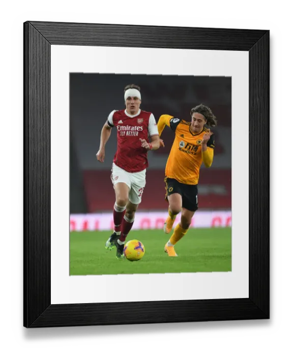 Framed Print : David Luiz vs. Fabio Silva: A Rivalry Unfolds in Empty Emirates Stadium - Arsenal vs. Wolverhampton Wanderers, Premier League 2020-21