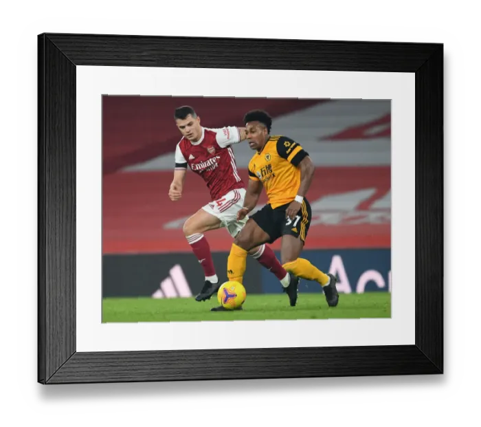 Framed Print : Xhaka's Defiant Performance: Shutting Down Traore in Empty Emirates (Arsenal vs. Wolverhampton Wanderers, Premier League 2020-21)