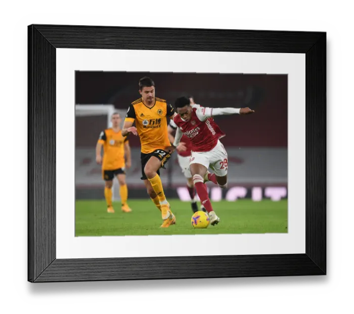 Framed Print : Clash of Midfield Titans: Joe Willock vs. Leander Dendoncker in Empty Emirates Stadium, Arsenal vs. Wolverhampton Wanderers, Premier League 2020-21