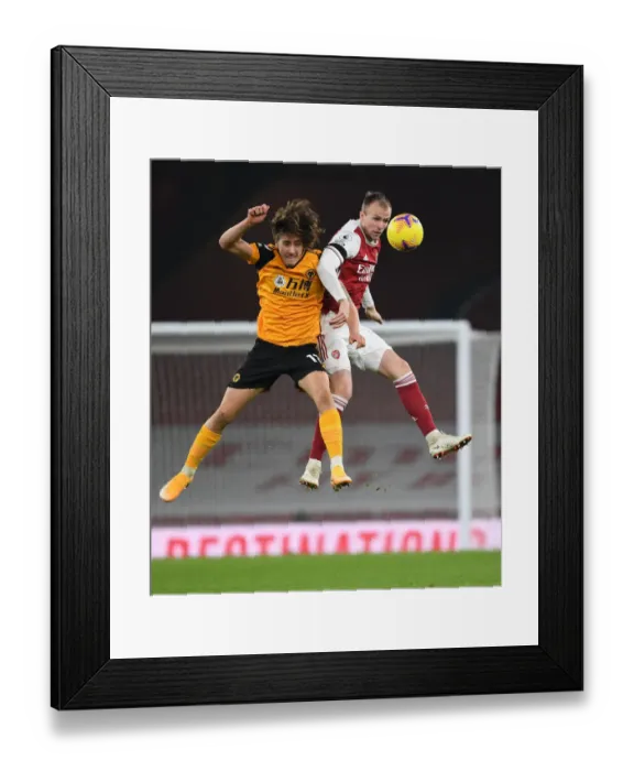 Framed Print : Arsenal vs. Wolves: Silent Battle at Emirates Amidst Pandemic