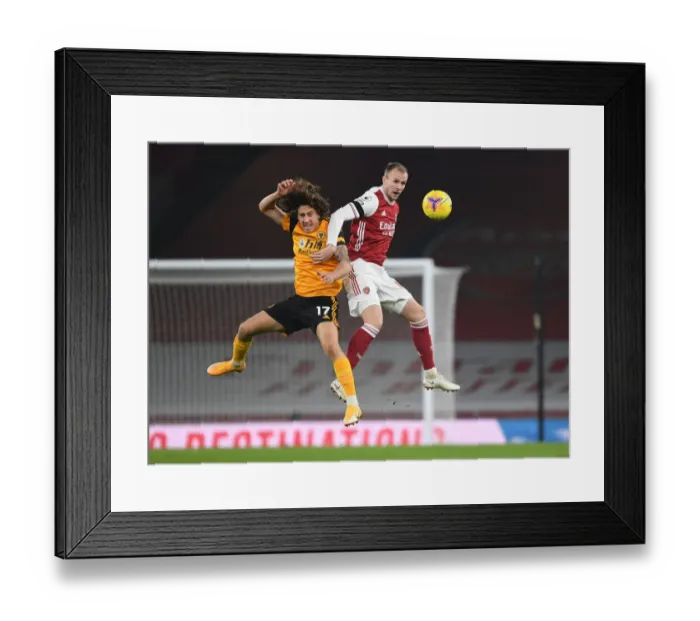 Framed Print : Arsenal vs. Wolverhampton Wanderers: Rob Holding's Heading Duel in Empty Emirates Stadium (Premier League 2020-21) Framed Print : Arsenal vs. Wolverhampton Wanderers: Rob Holding's Heading Duel in Empty Emirates Stadium (Premier League 2020-21)