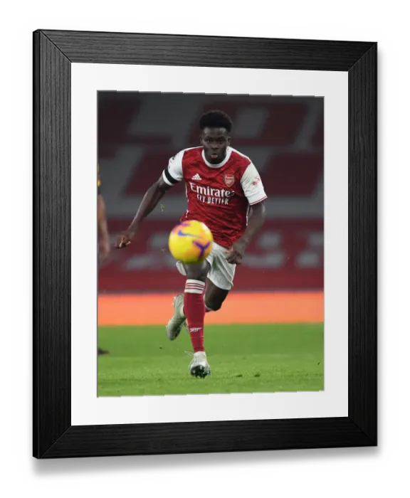 Framed Print : Arsenal's Bukayo Saka in Action: Arsenal vs. Wolverhampton Wanderers (2020-21) - Emirates Stadium Framed Print : Arsenal's Bukayo Saka in Action: Arsenal vs. Wolverhampton Wanderers (2020-21) - Emirates Stadium