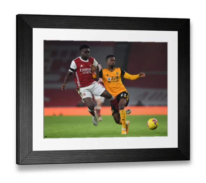 Framed Print : Empty Battle: Saka vs. Semedo at the Ghostly Emirates - Arsenal vs. Wolverhampton Wanderers (Premier League 2020-21)
