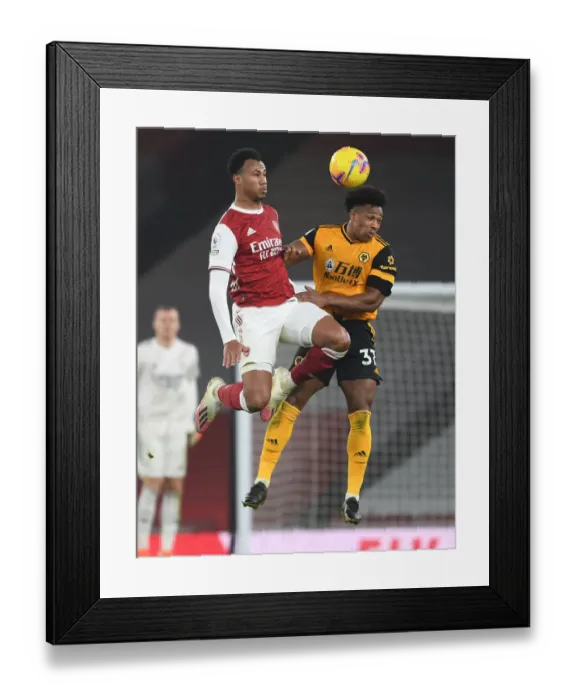 Framed Print : Gabriel Magalhaes Under Pressure: Arsenal vs. Wolverhampton Wanderers (Premier League 2020-21)