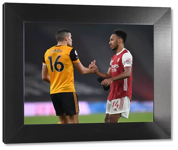 Empty Emirates: Aubameyang and Coady's Unique Handshake - Arsenal vs. Wolverhampton Wanderers Amidst Pandemic Restrictions (Premier League 2020-21)