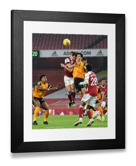 Framed Print : Clash of Heads: David Luiz vs. Raul Jimenez - Arsenal vs. Wolverhampton Wanderers, Empty Emirates Stadium, Premier League 2020-21