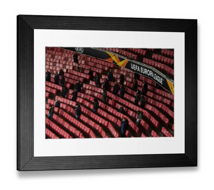 Framed Print : Empty Emirates: Arsenal Fans Watch Team Warm-Up during Closed-Doors Europa League Match vs Rapid Wien (December 2020)