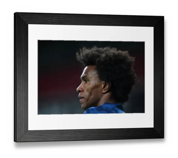 Framed Print : Arsenal's Willian in Emirates Stadium: A Lone Figure in the UEFA Europa League Amidst Closed Doors