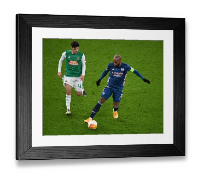 Framed Print : Lacazette Scores Alone: Emirates Stadium's Empty Stands - Arsenal vs. SK Rapid Wien, UEFA Europa League 2020-21
