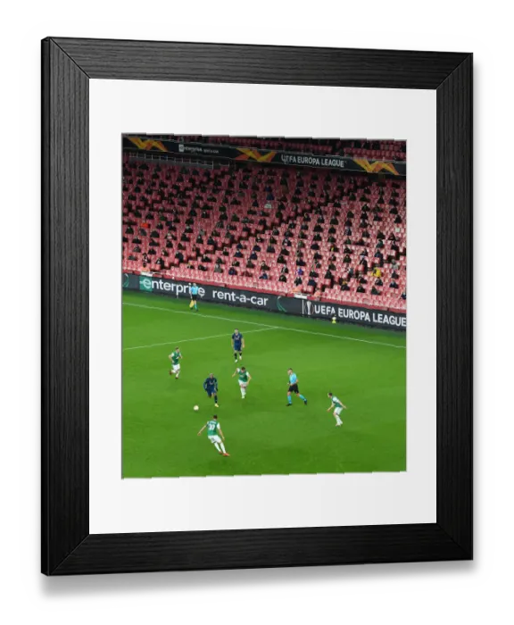 Framed Print : Arsenal's Emirates Stadium: A Ghostly Arena in UEFA Europa League Match Against Rapid Wien Amidst Pandemic Restrictions